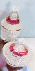Two Westmoreland English Hobnail ruby flash footed candy dishes with lids. Clear glass with hobnail texture and ruby red accents.