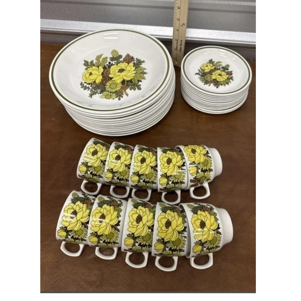 Back Road Vintage Valuables set of 1970s Grindleys Mayflower plates and mugs with yellow floral pattern and green trim.